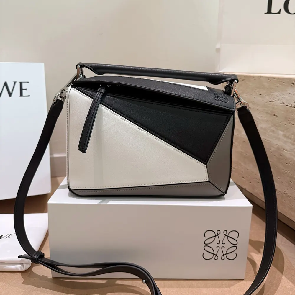 Close-up detail of geometric puzzle construction on Loewe Small Puzzle Bag