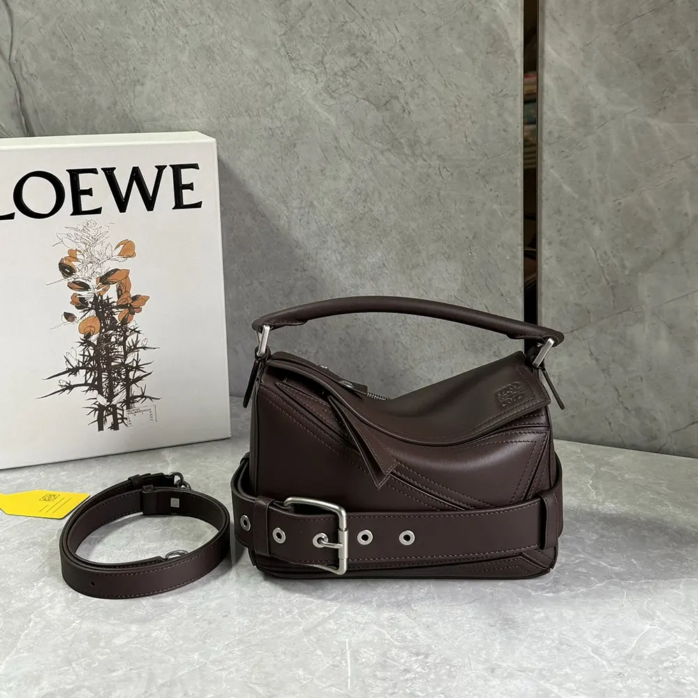 Close-up of polished hardware and magnetic closure on Loewe Small Puzzle Biker Bag