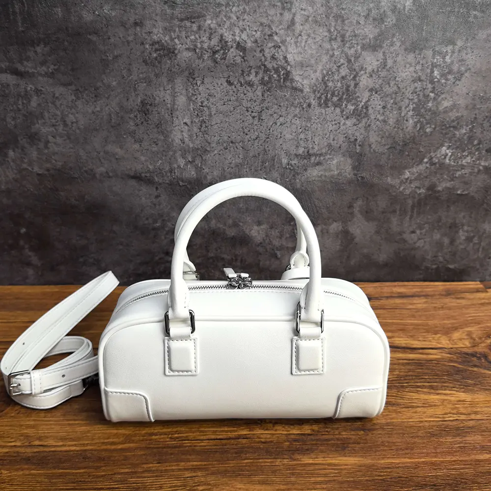 Side profile showing compact silhouette of Loewe Women Amazona 23 Cropped Bag