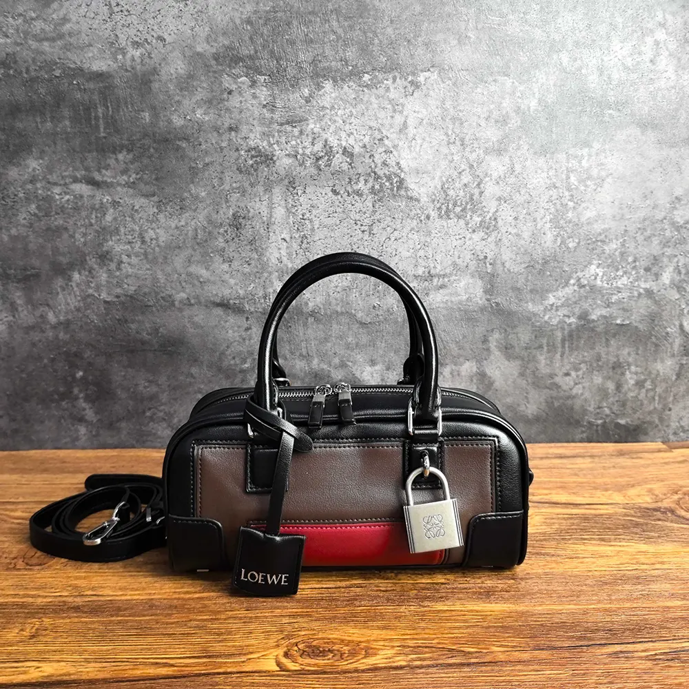 Close-up of nappa calfskin texture and embossed hardware on Loewe Amazona 23