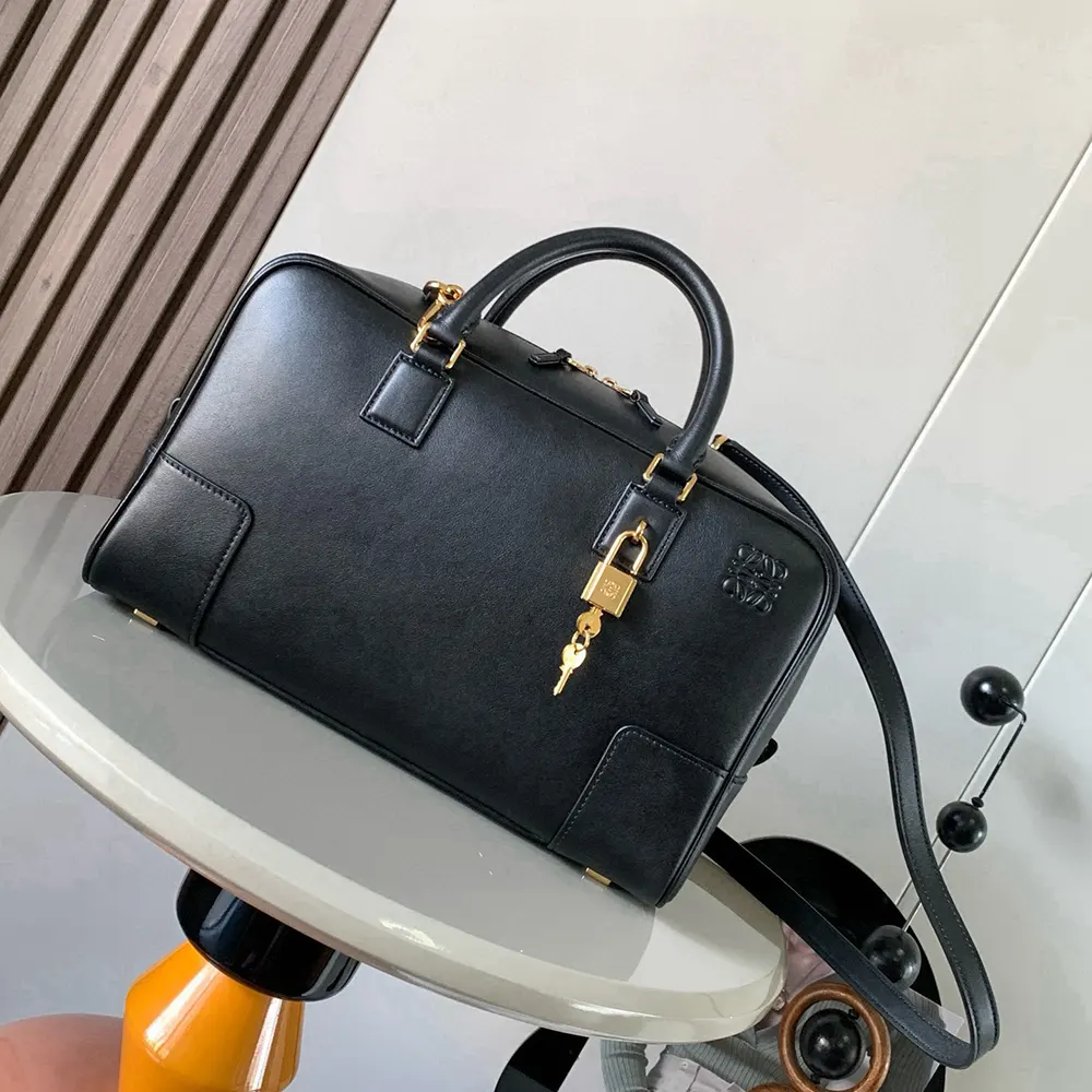 Close-up on brushed gold hardware and zip closure of Loewe Amazona 28