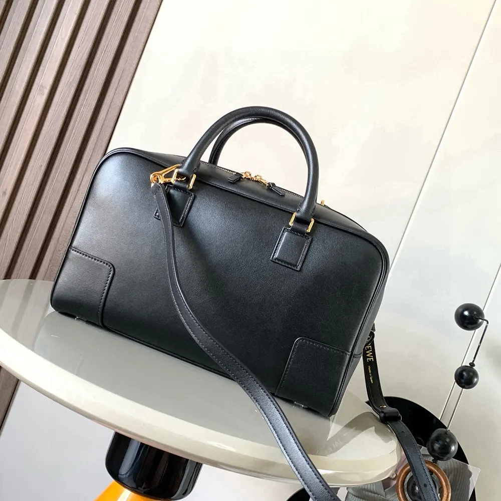 Side angle showing silhouette and leather texture of Loewe Unisex Amazona 28 Bag