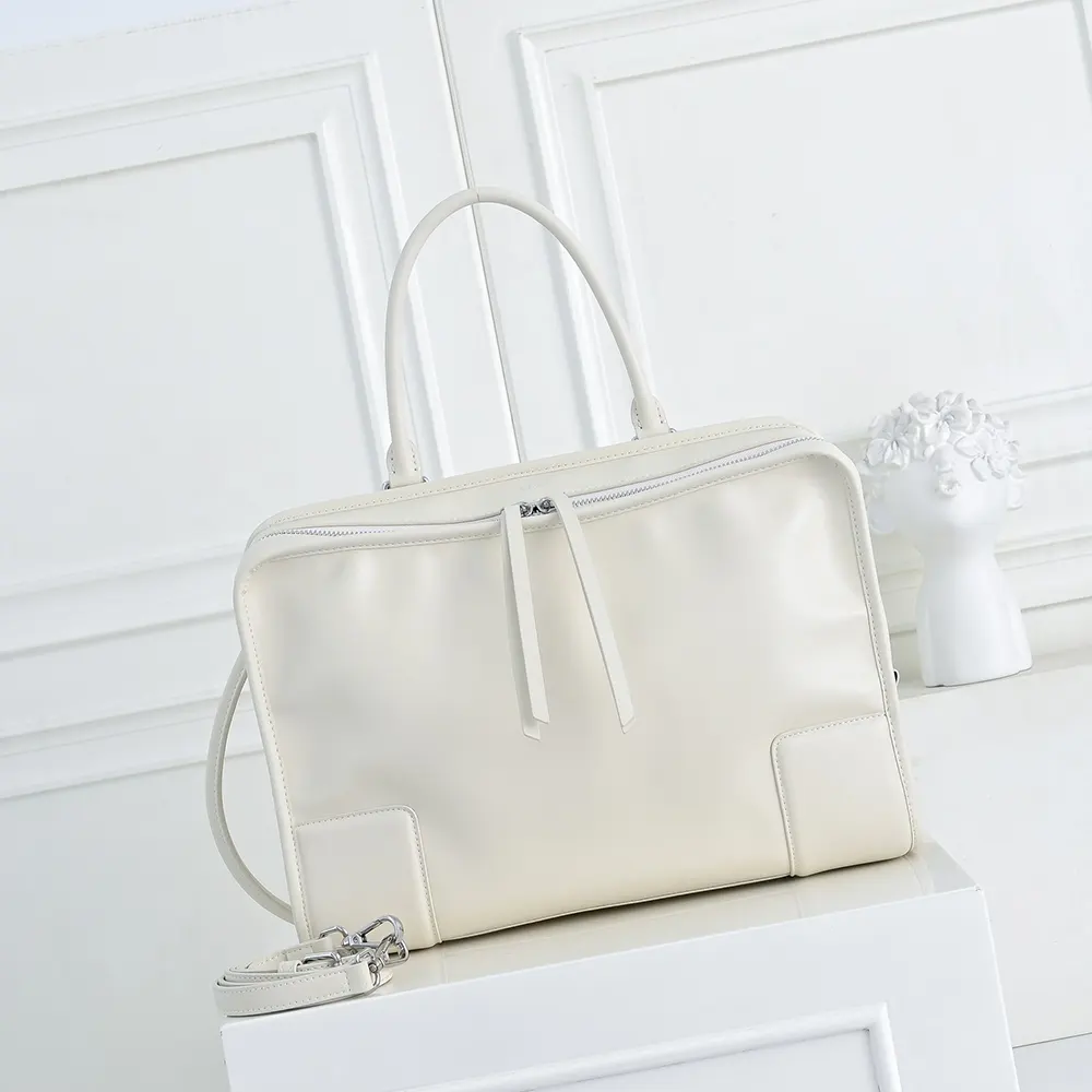 Close-up of silver hardware and white calfskin on Loewe Large Amazona 180 Bag