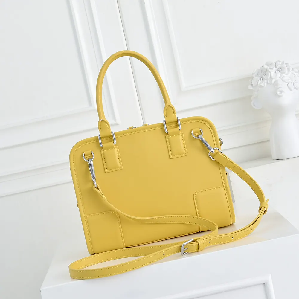 Side profile showing silhouette and soft calfskin texture of Loewe Large Amazona