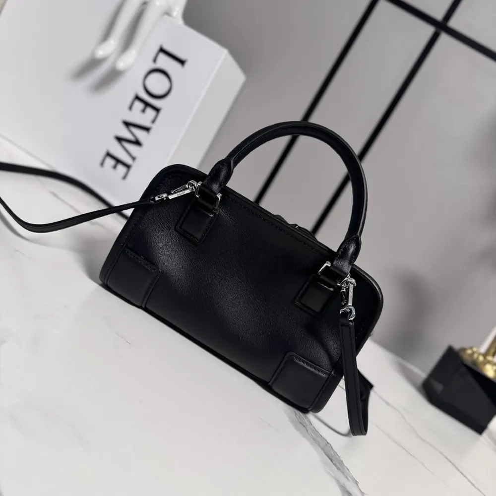 Side angle showing compact silhouette of Loewe Mini Amazona 180 Bag
