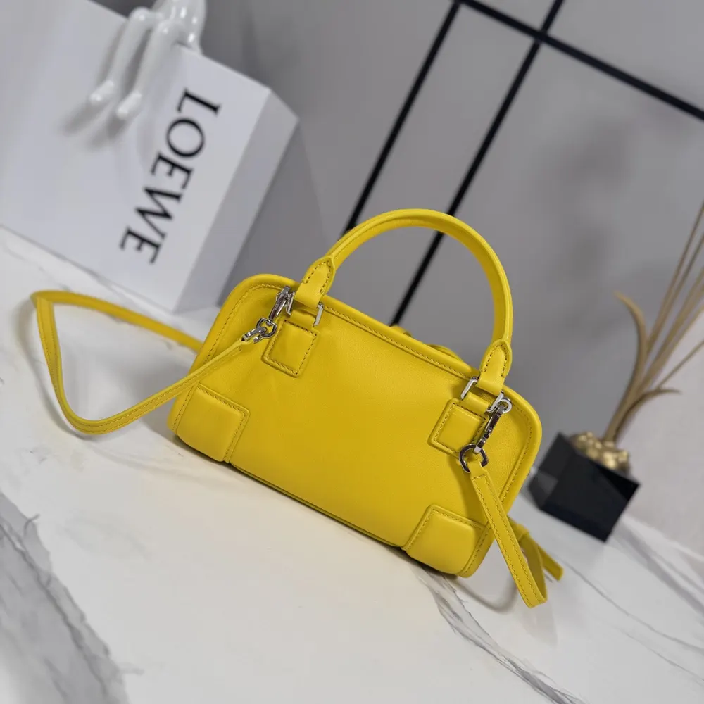 Side angle showing compact size of Loewe Women Mini Amazona 180 Bag