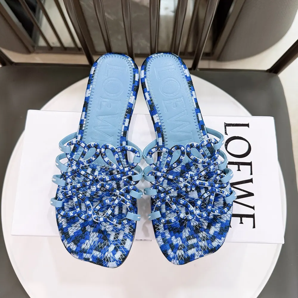 Close-up on embroidered Anagram detail on Loewe Women Petal Anagram Slide