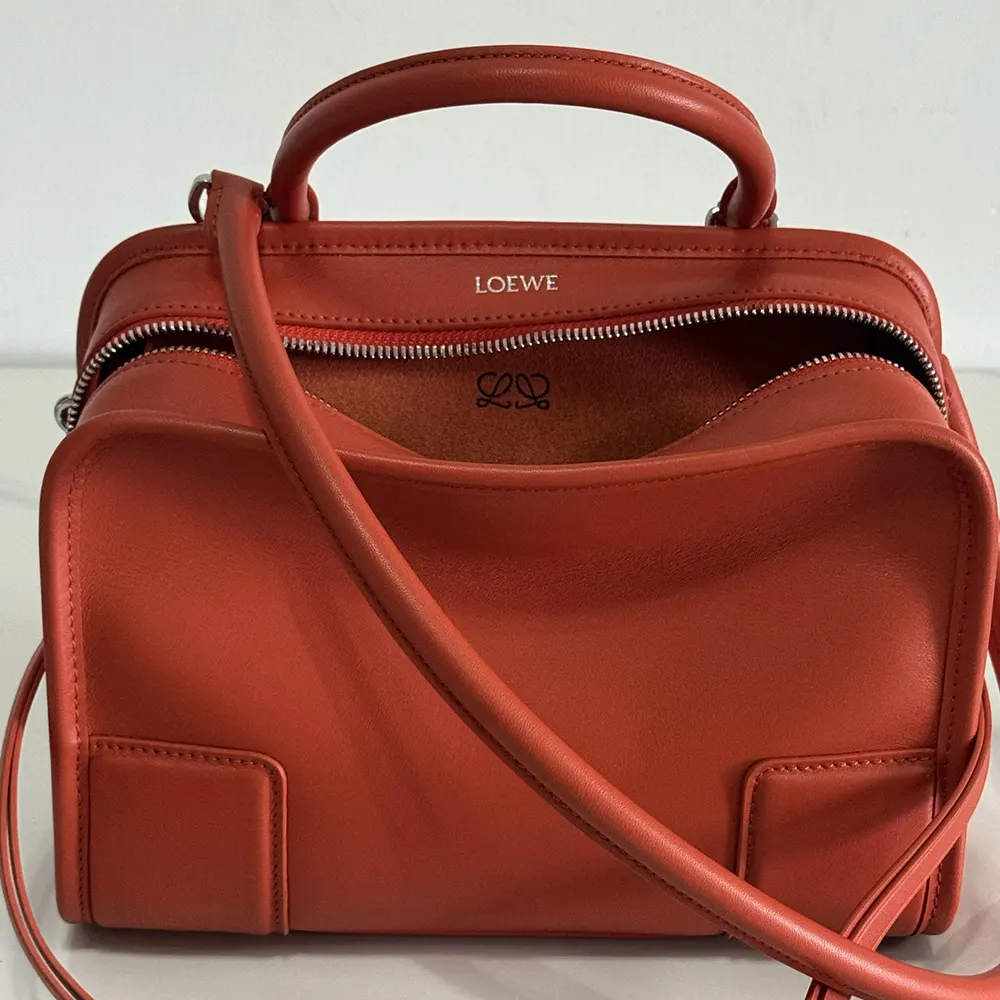 Side profile showing compact silhouette of Loewe Small Amazona 180 Bag