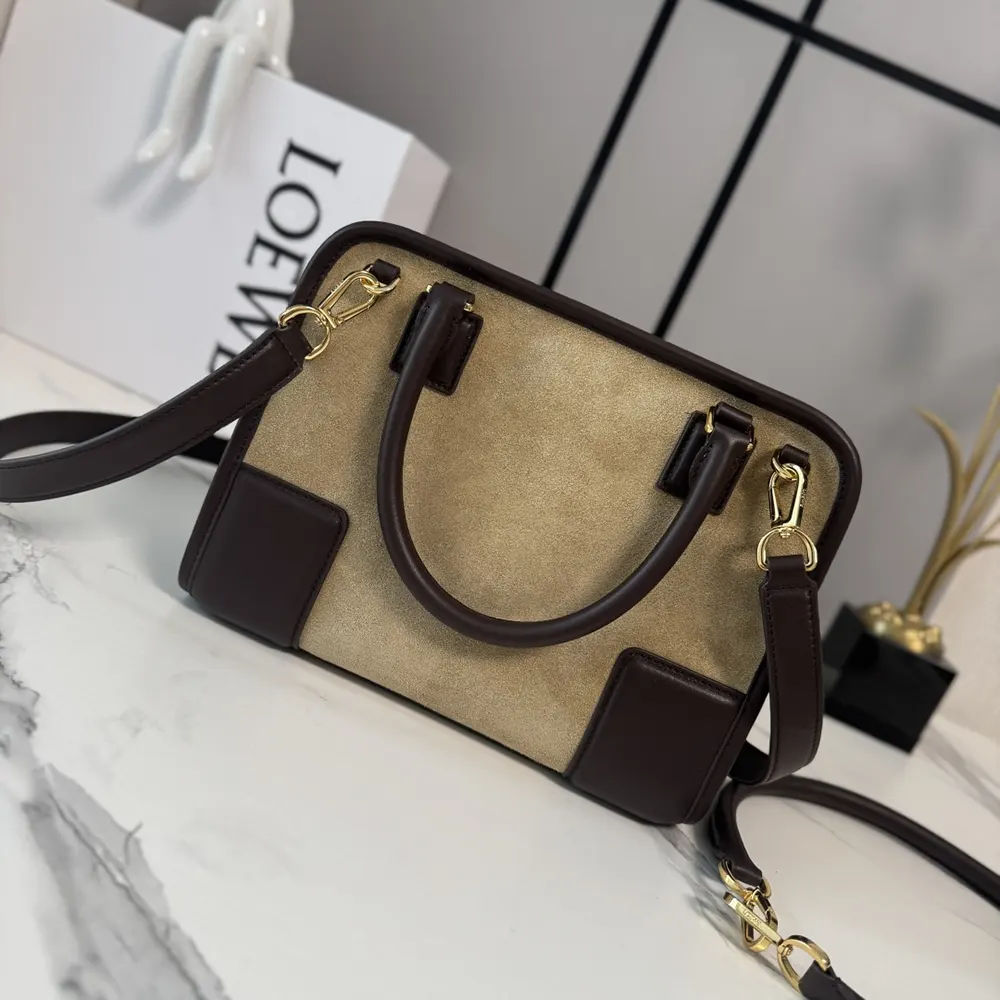 Side angle showing compact silhouette of Loewe Women Small Amazona 180 Bag