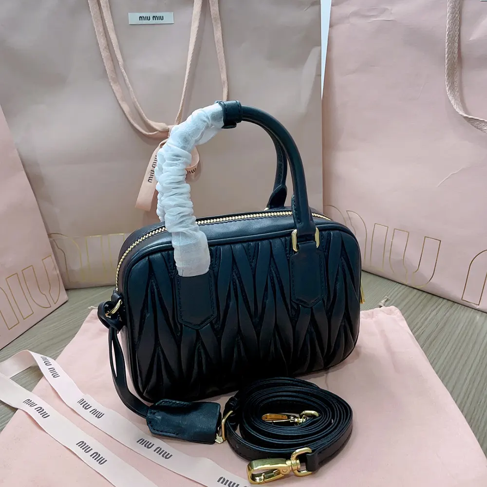 Side profile showing silver-tone hardware on Miu Miu Arcadie Nappa Leather Bag