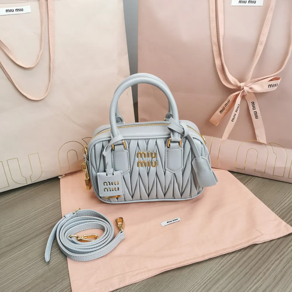 Close-up of matelassé quilting and silver hardware on Miu Miu bag
