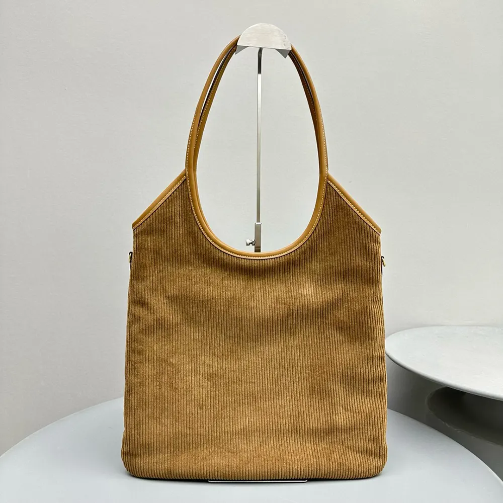 Side angle showing gold hardware and adjustable strap of Miu Miu Women IVY Corduroy Bag