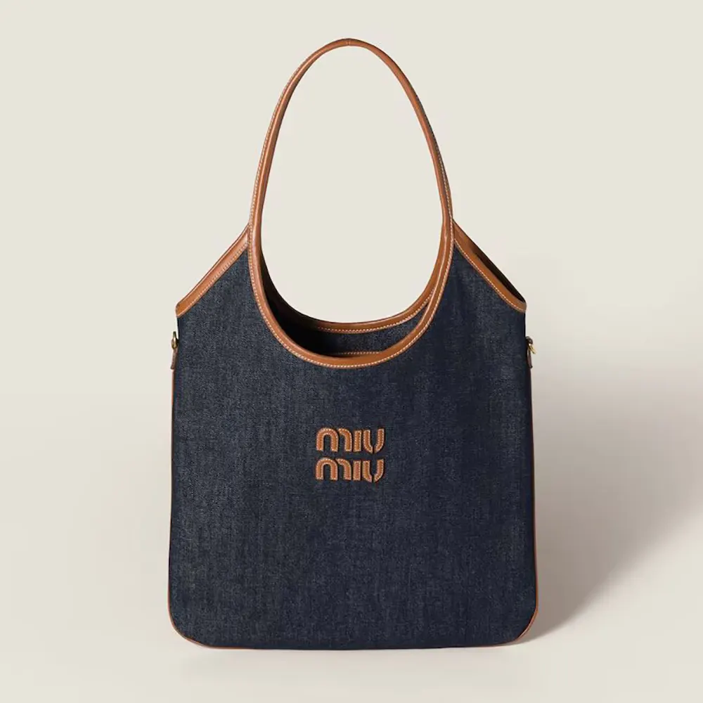 Front view of Miu Miu Women Ivy Denim Bag in navy with quilted pattern