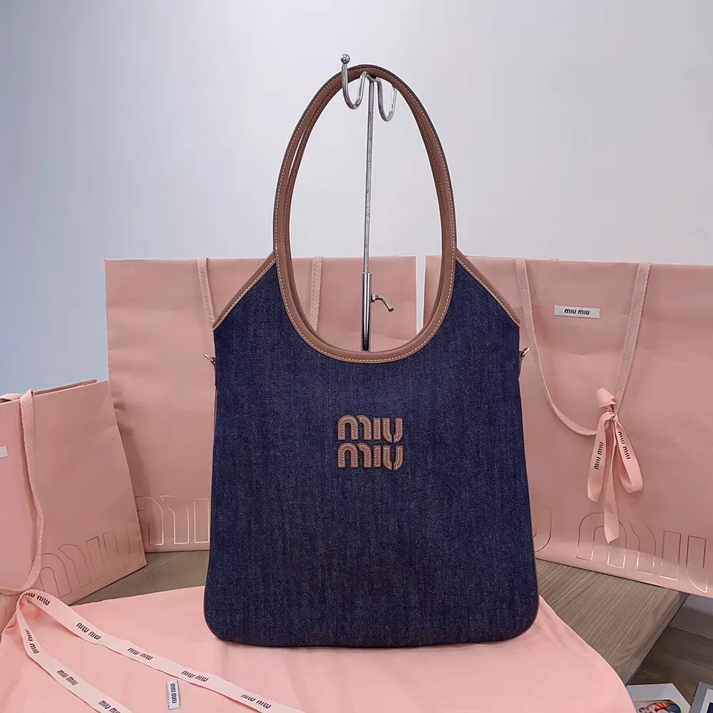 Close-up of silver hardware and zip closure on Miu Miu Women Ivy Denim Bag