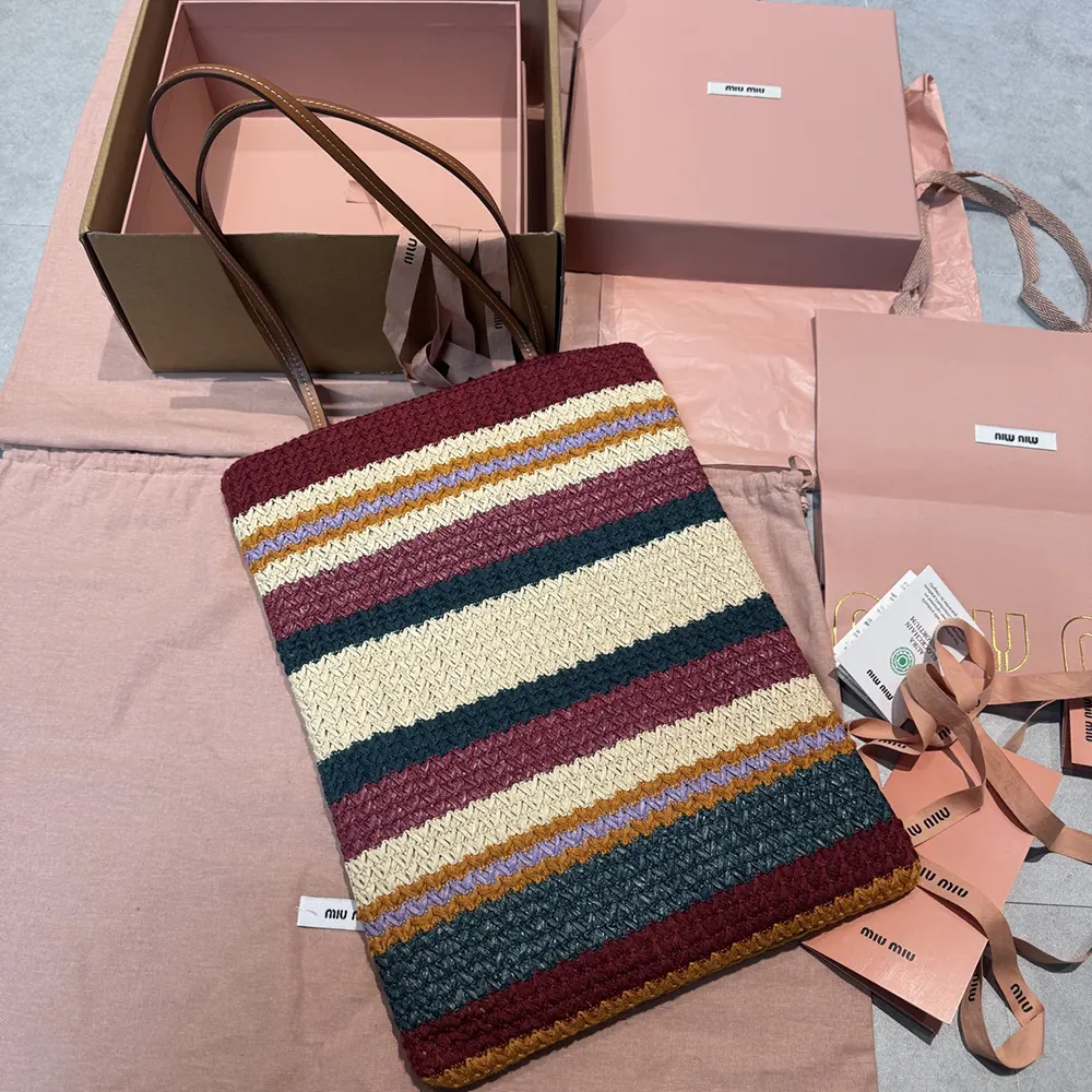 Side view showing spacious interior and zip closure of Miu Miu woven tote