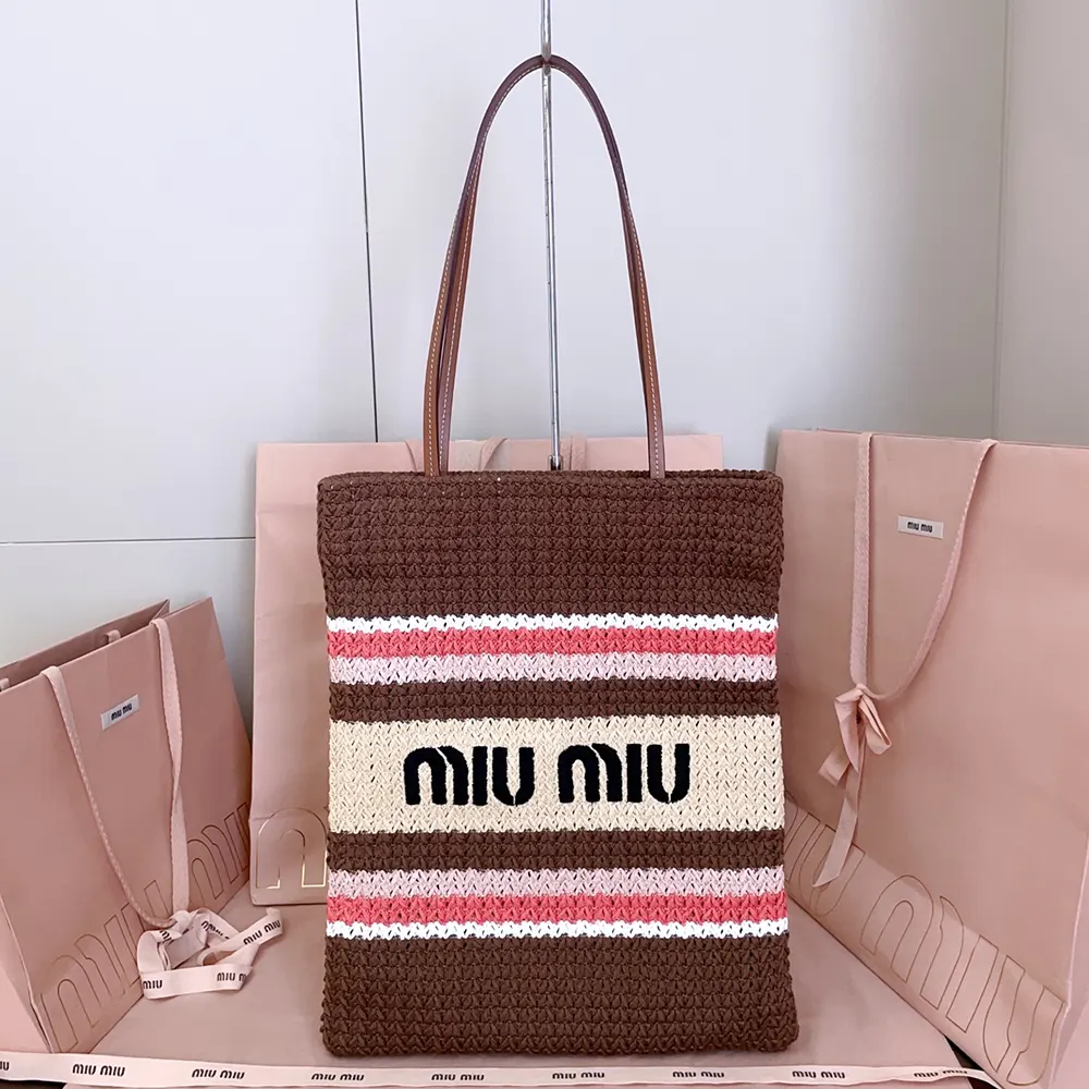 Close-up detail of woven raffia texture on Miu Miu tote bag