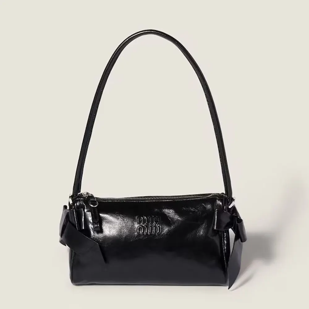 Front view of Miu Miu Women Shiny Leather Pouch-Black showing sleek silhouette