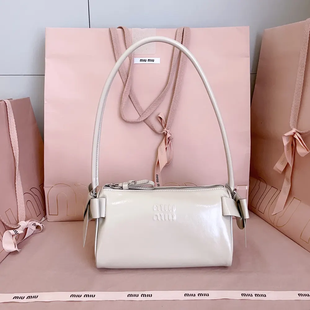 Close-up of silver hardware on Miu Miu Women Shiny Leather Pouch-Pink