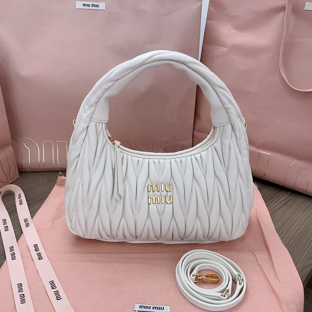 Close-up on matelassé quilting and silver hardware on Miu Miu Women Wander bag