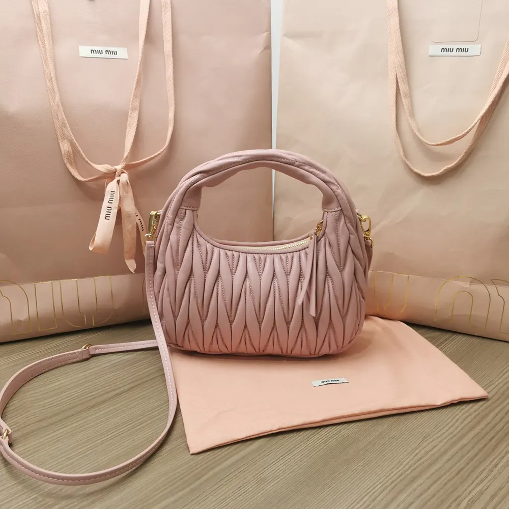Side angle showcasing hobo silhouette of Miu Miu Women Wander Matelassé Bag