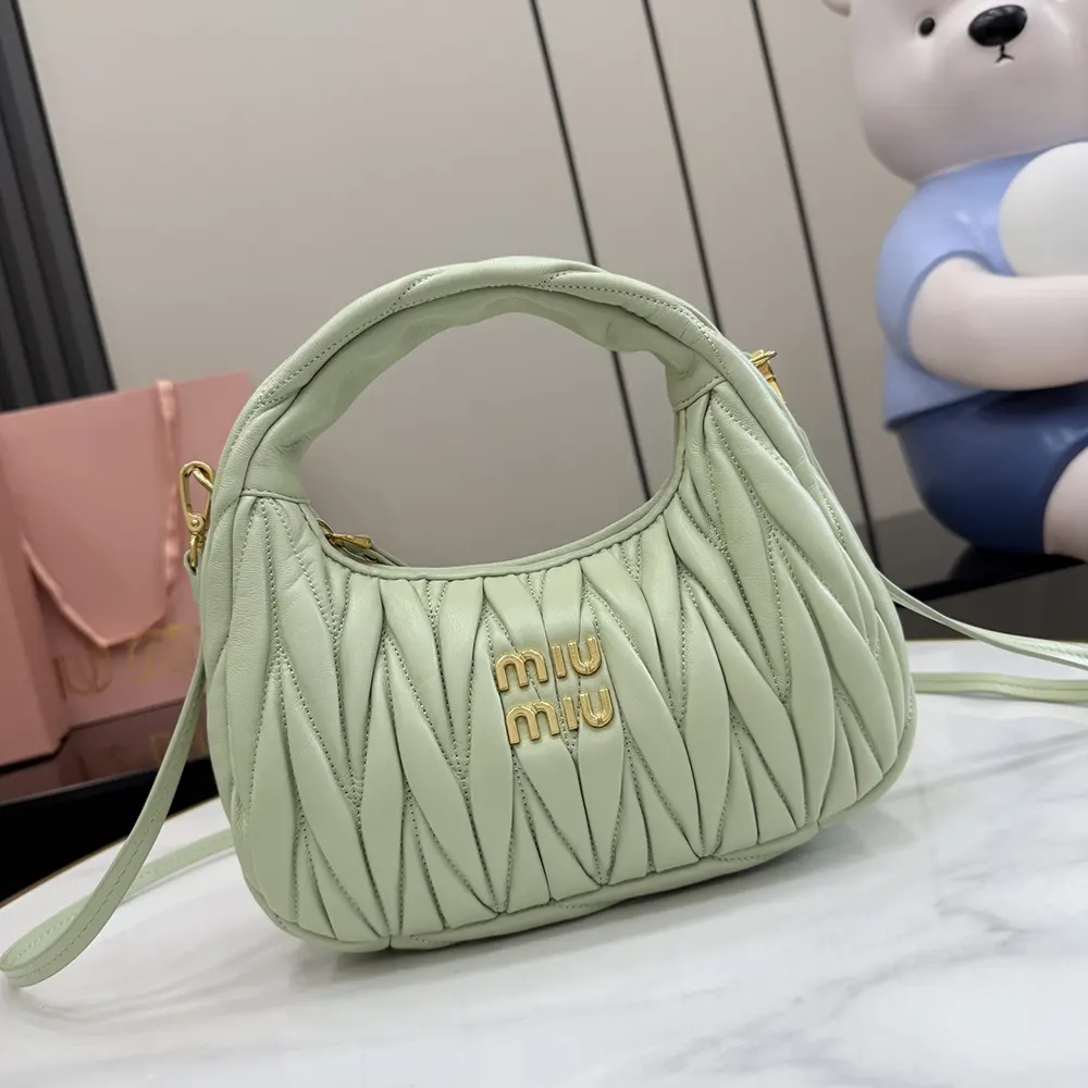 Close-up detail of quilted matelassé leather on Miu Miu Women Wander Hobo Bag