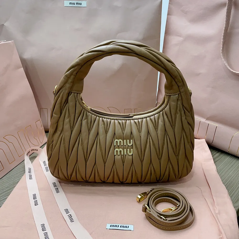 Close-up detail of caramel matelassé quilting on Miu Miu Women Wander bag
