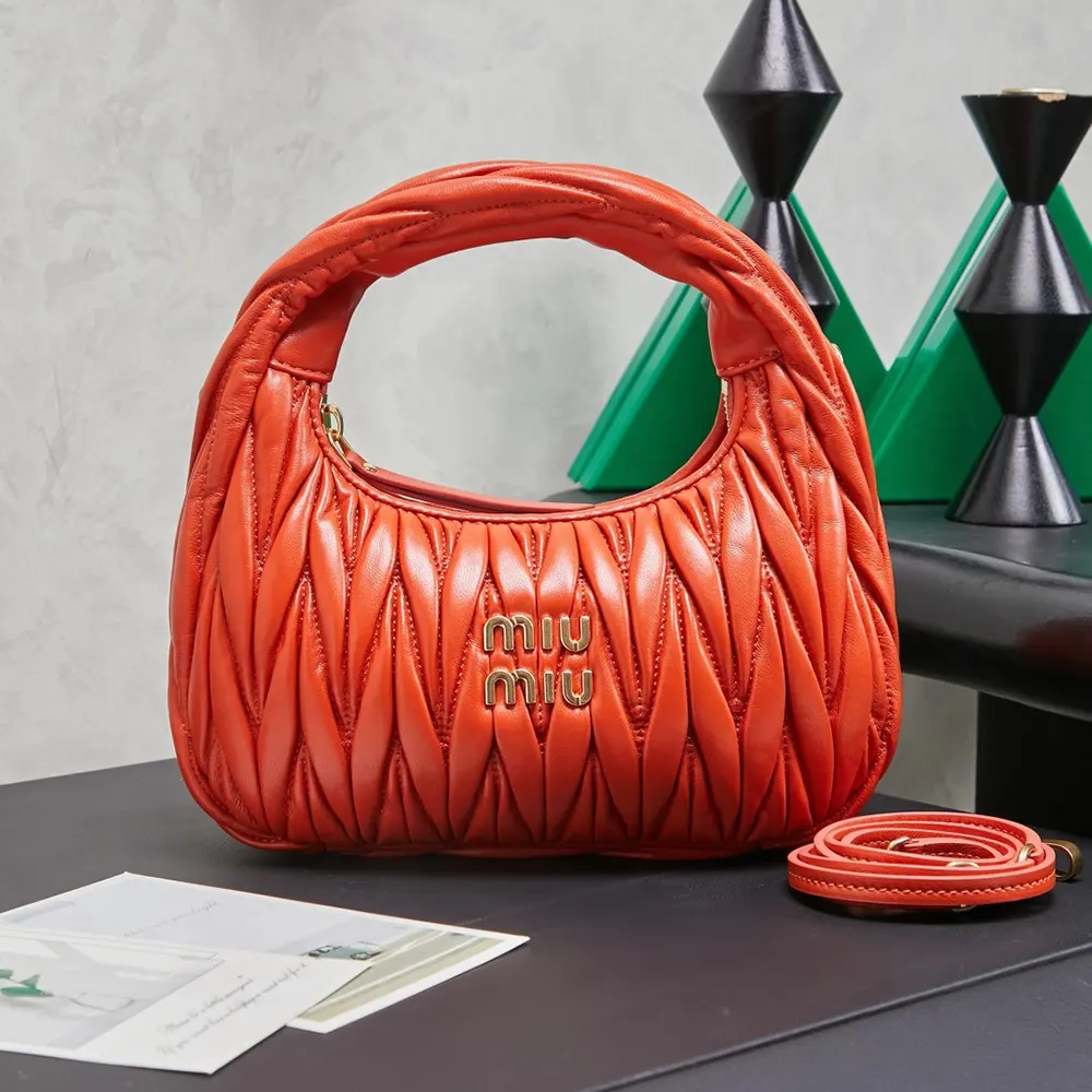 Close-up of matelassé quilting on Miu Miu Women Wander Hobo Bag-Orange