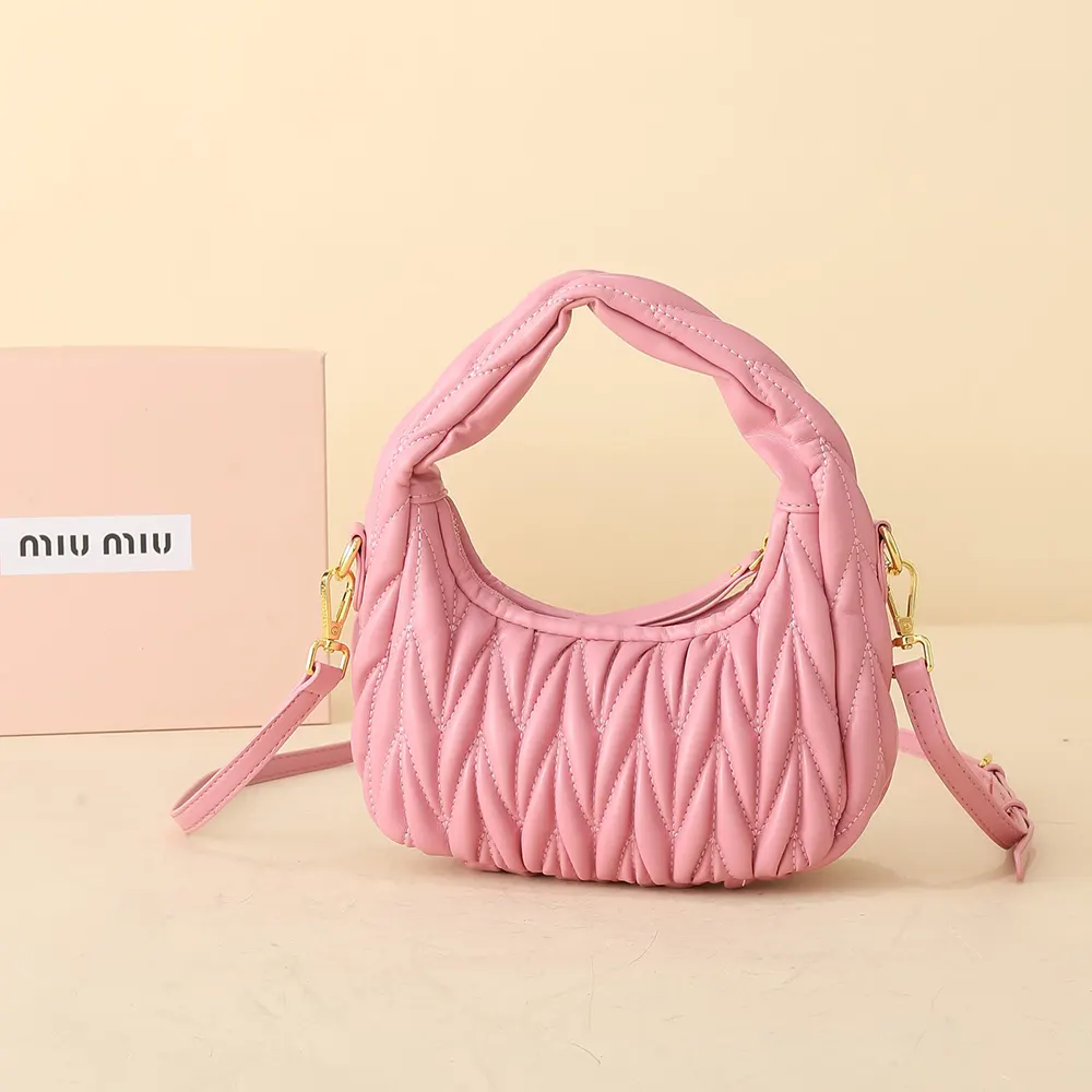 Side profile showing soft silhouette of Miu Miu pink hobo bag