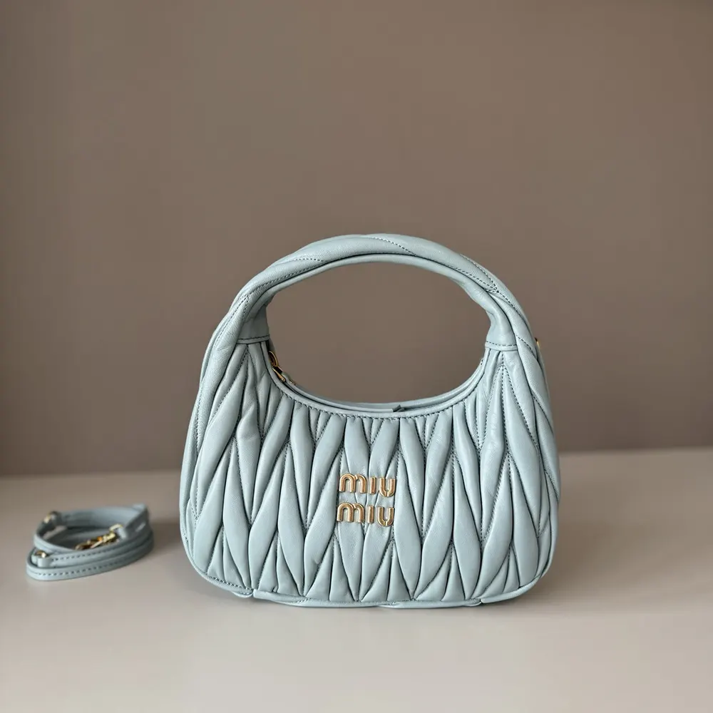 Side angle of Miu Miu Women Wander Matelassé Nappa Leather Hobo Bag showing silhouette