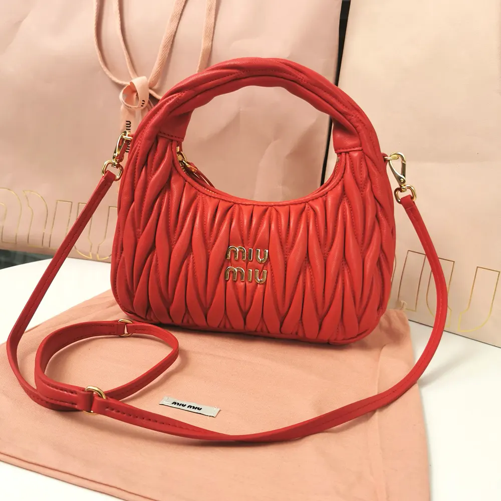 Close-up of matelassé texture on Miu Miu Wander red leather bag
