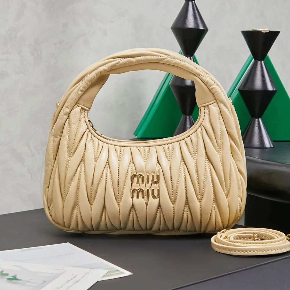 Close-up on quilted matelassé leather texture of the Miu Miu Women Wander Hobo Bag