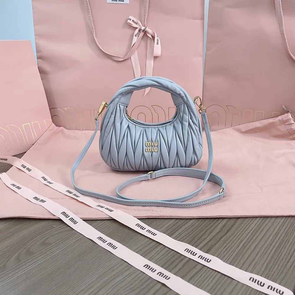 Side profile showing soft silhouette of Miu Miu Women Wander Hobo Mini-Bag