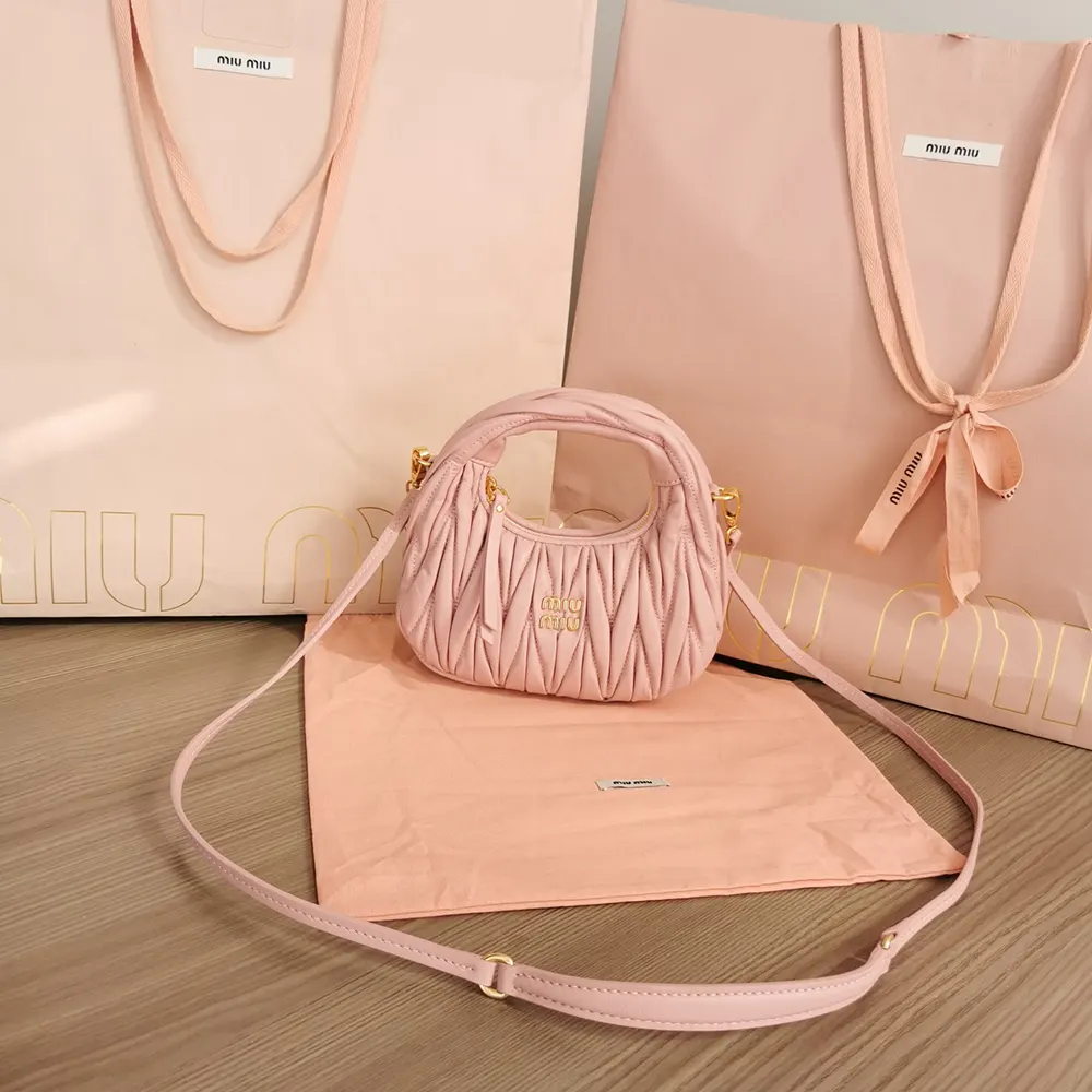 Close-up of matelassé quilting detail on Miu Miu mini hobo bag