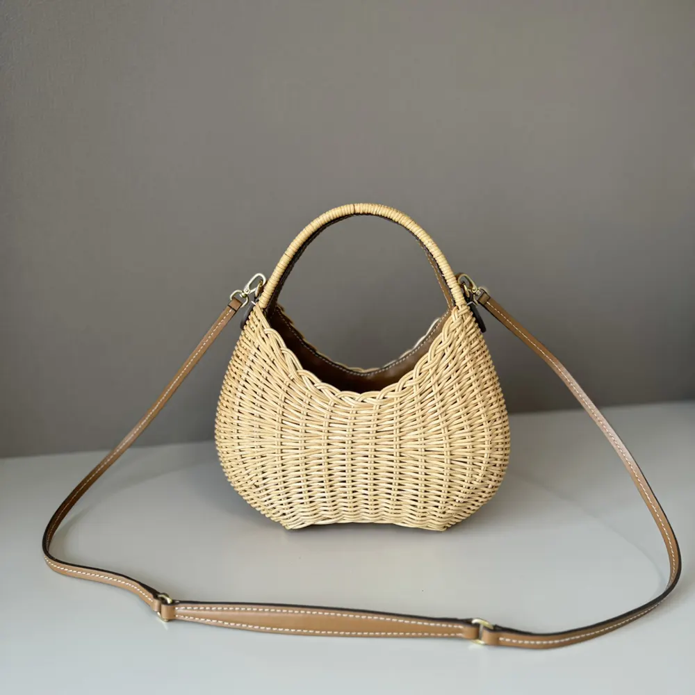 Side view of Miu Miu Women Wander Wicker Handbag highlighting adjustable shoulder strap