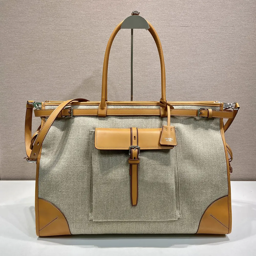 Close-up of leather trim and brushed gold hardware on Prada Bonnie Tote