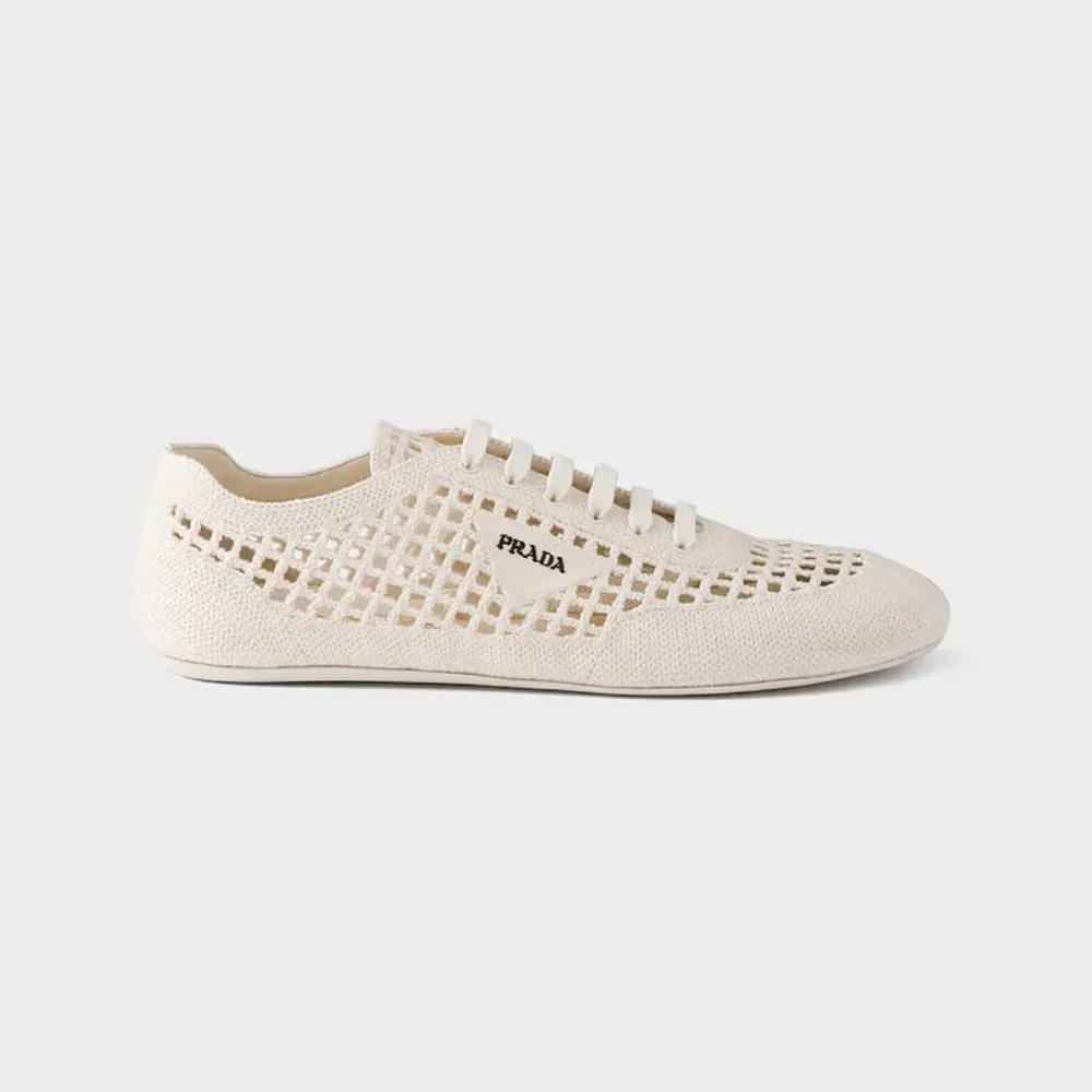 Side angle of Prada Unisex Collapse Crochet Laced Sneakers-White showing crochet texture