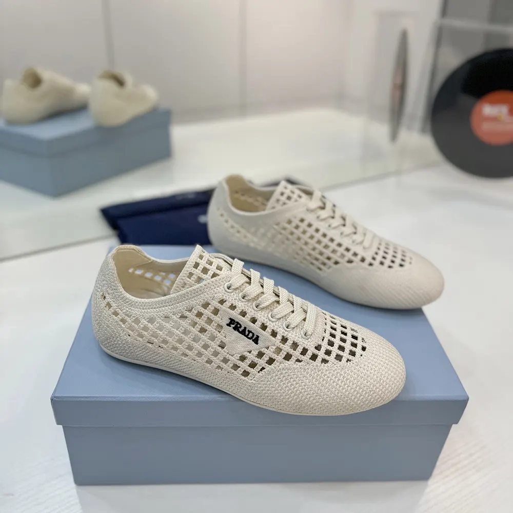 Top-down close-up of Prada Unisex Collapse Crochet Laced Sneakers-White lacing detail
