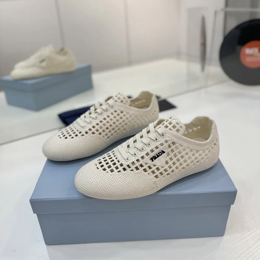 Rear view of Prada Unisex Collapse Crochet Laced Sneakers-White highlighting silhouette