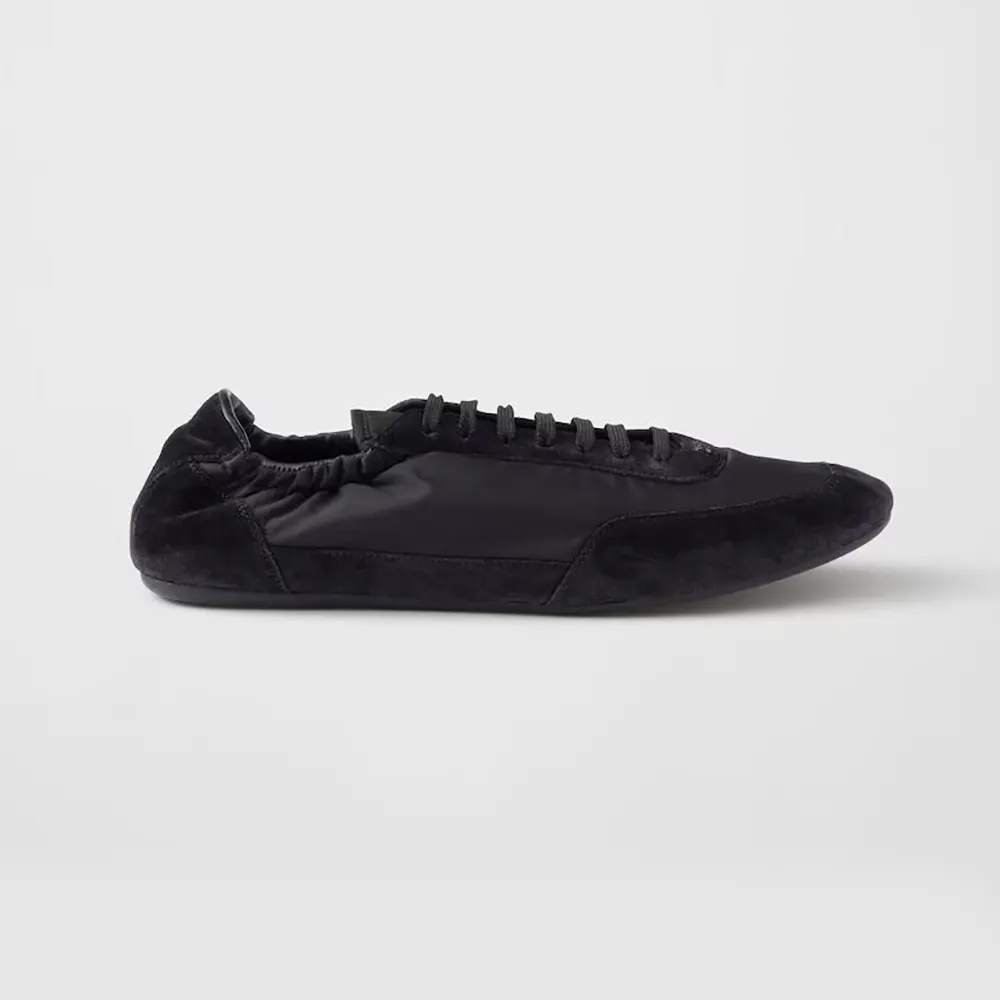 Side view of Prada Unisex Collapse Re-Nylon and Suede Elasticized Sneakers-Black