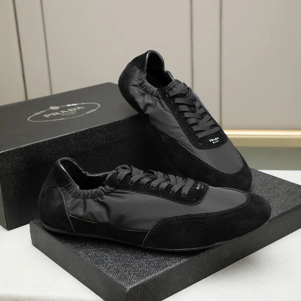 Close-up of black suede and elastic detail on Prada Collapse sneakers