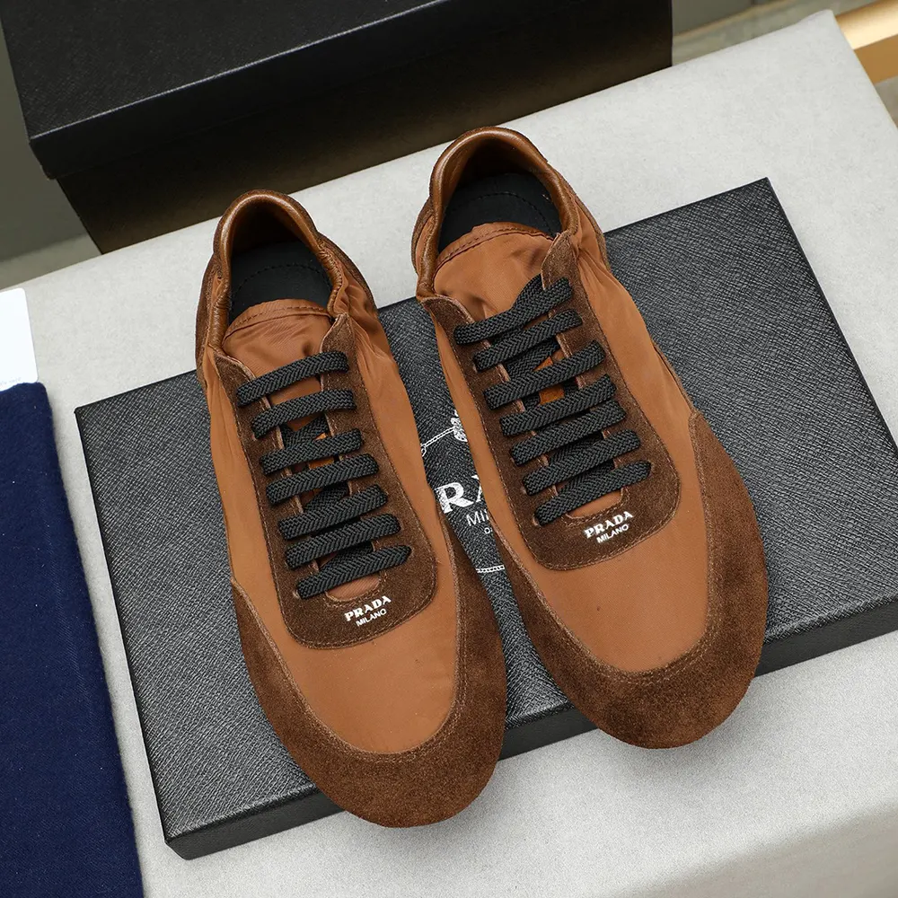 Close-up on suede detail and elastic closure of Prada Unisex Collapse Sneakers