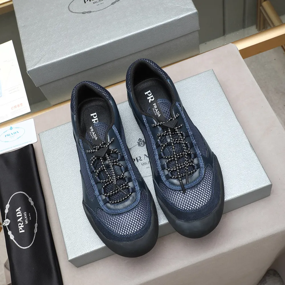 Close-up on navy patent leather and mesh fabric detail of Prada Speedrock sneakers