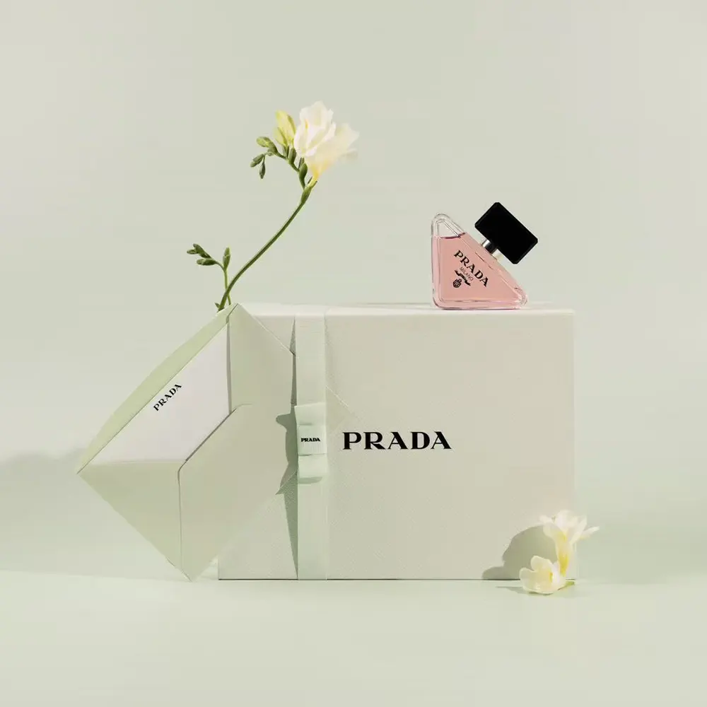 Close-up of pink glass and embossed cap on Prada Women Paradoxe