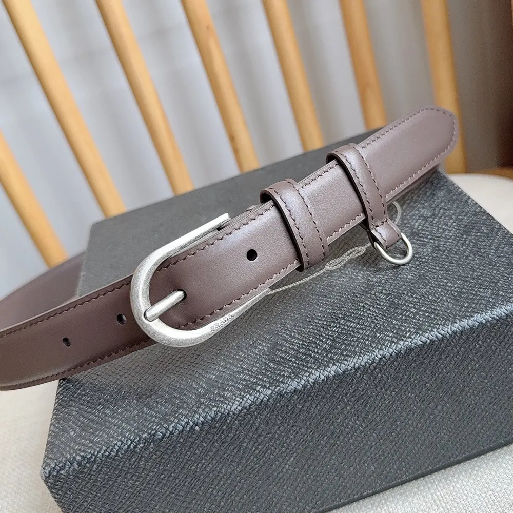 Side angle showing slim silhouette of Prada Women Antiqued Leather Belt