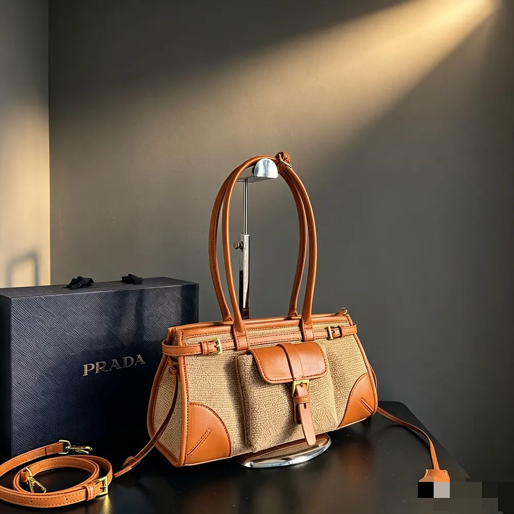 Side profile showing silhouette of Prada Women Bonnie Medium Linen and Leather Handbag
