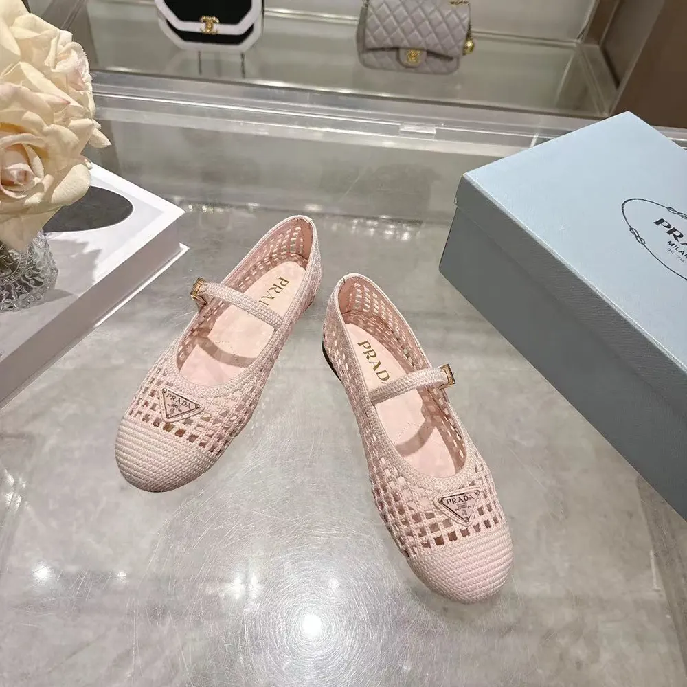 Close-up of Prada logo detail inside crochet ballerinas in orchid pink