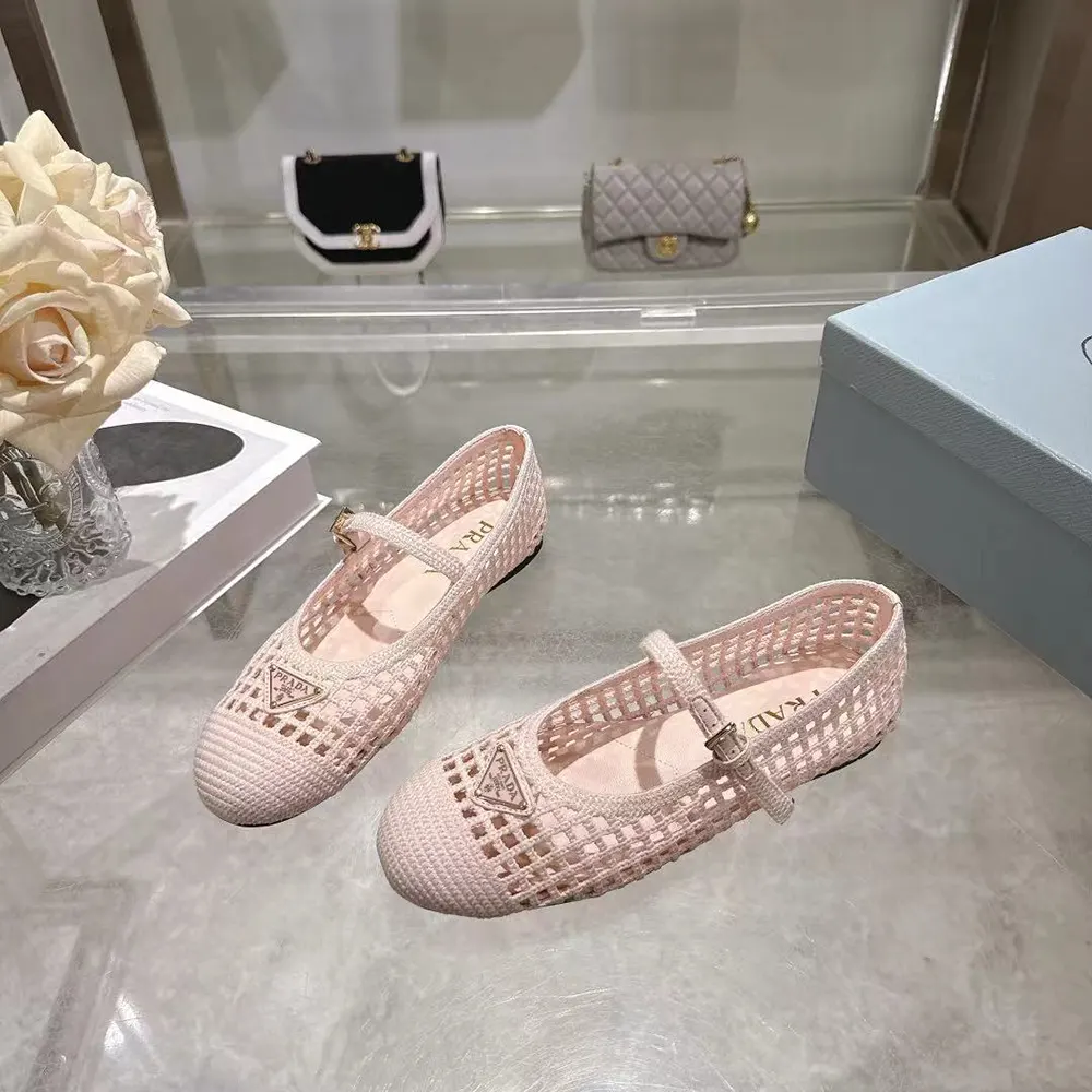 Top-down angle highlighting orchid pink crochet upper of Prada ballerinas