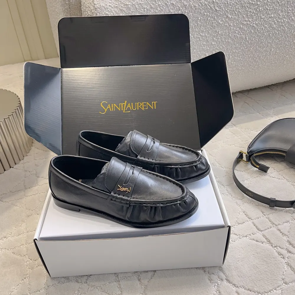 Top angle showing supple matte black leather on Saint Laurent YSL loafer