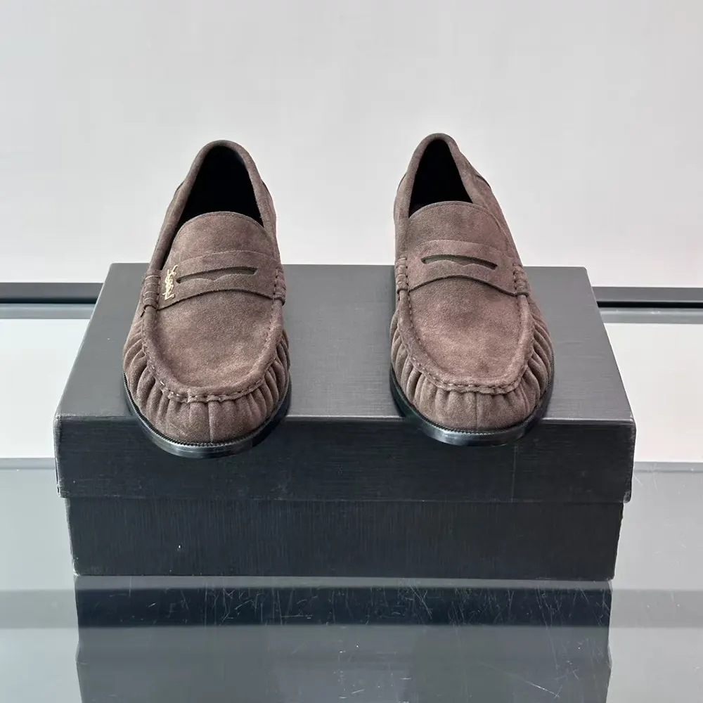 Overhead angle showing chocolate suede texture on Saint Laurent YSL loafer
