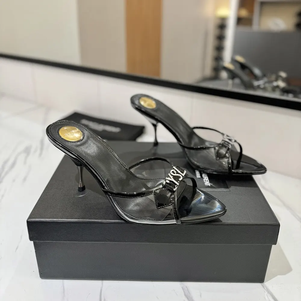 Top-down angle showing black TPU and heel on Saint Laurent YSL Jerry Mules